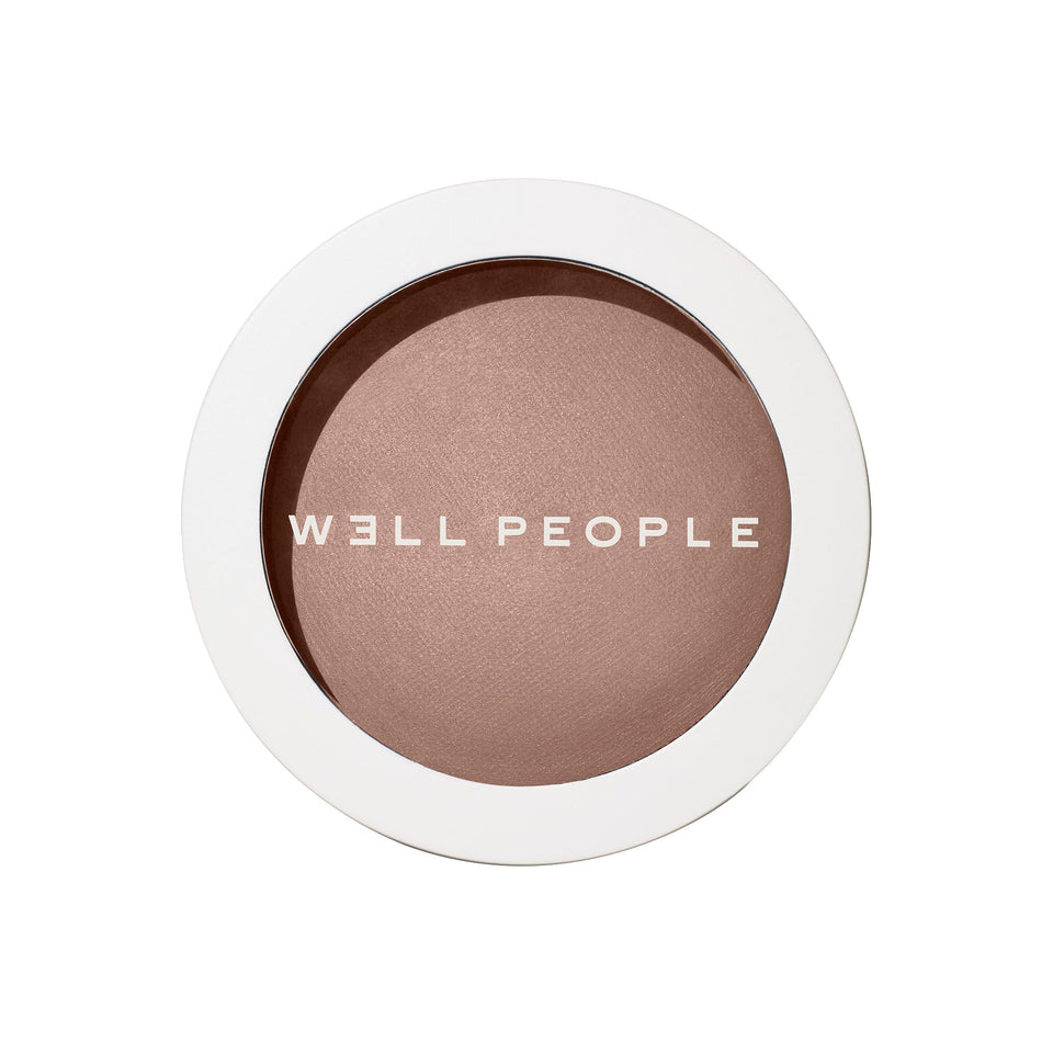 Well People compact front view showing bronzing powder for natural warmth