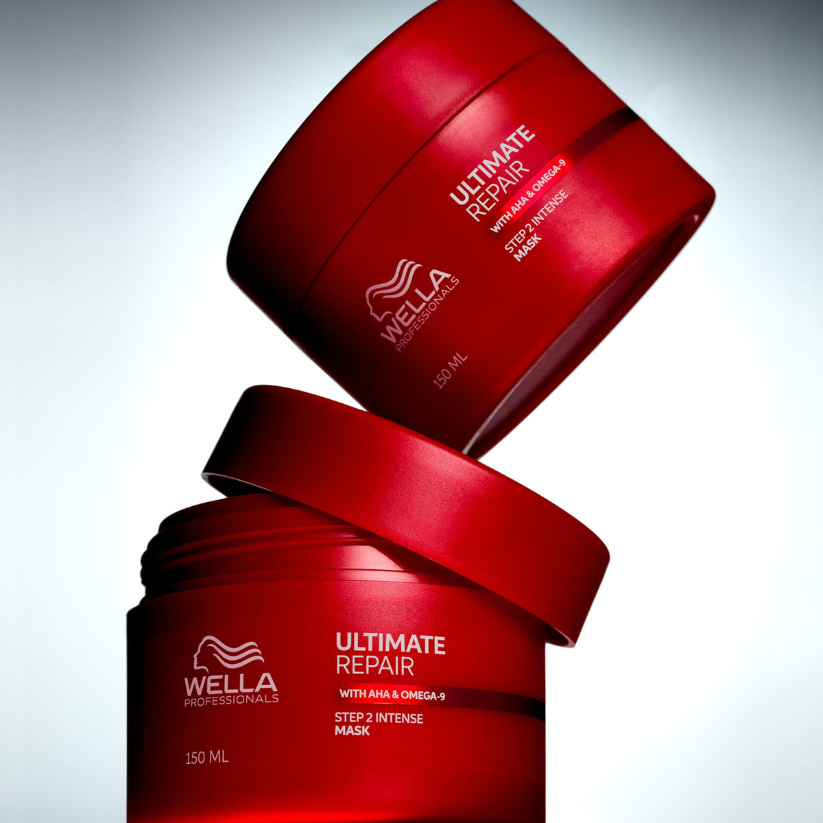Wella Professionals jar next to hand showing 16.9 fl oz scale