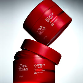 Wella Professionals jar next to hand showing 16.9 fl oz scale