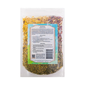 Well's Oil open jar with visible dried herbs for DIY infusion benefit