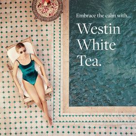 Westin bottle on bathroom counter lifestyle shot evoking spa‑like calm