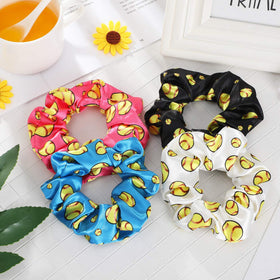WILLBOND scrunchies stacked to show size and stretch for thick hair
