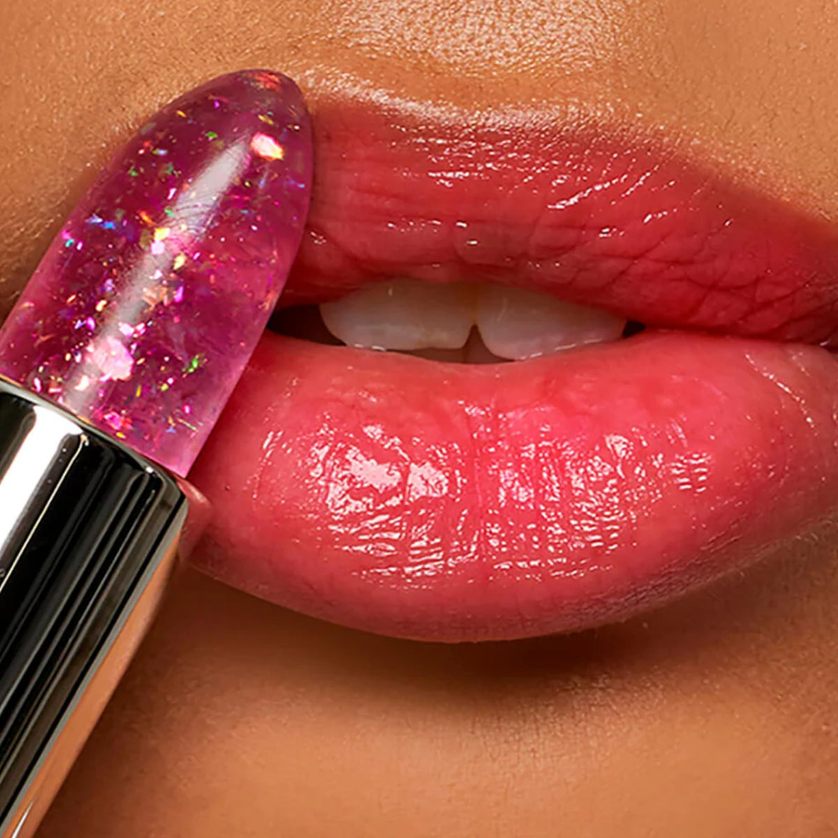 Winky Lux application on lips in mirror for instant customized pink and sheen