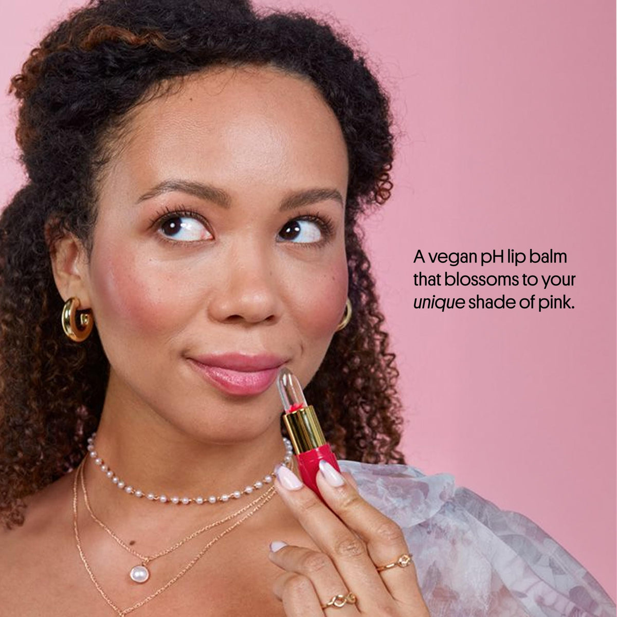 Winky Lux balm being smelled to highlight vanilla scent, comforting aroma benefit