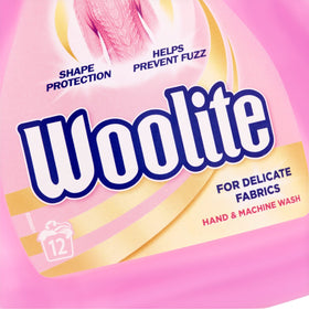Woolite liquid being poured showing texture and controlled dosage benefit