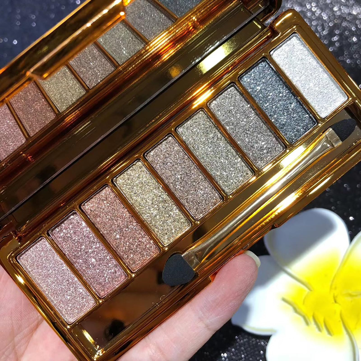 XFEXM palette front packaging showing nine shades and compact case for travel