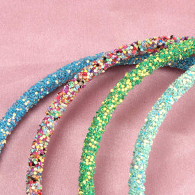 XIMA headband in child's hair keeping hair tidy and comfortable during play