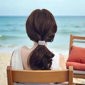 Xiwstar in an event-ready updo adding shine to a formal look