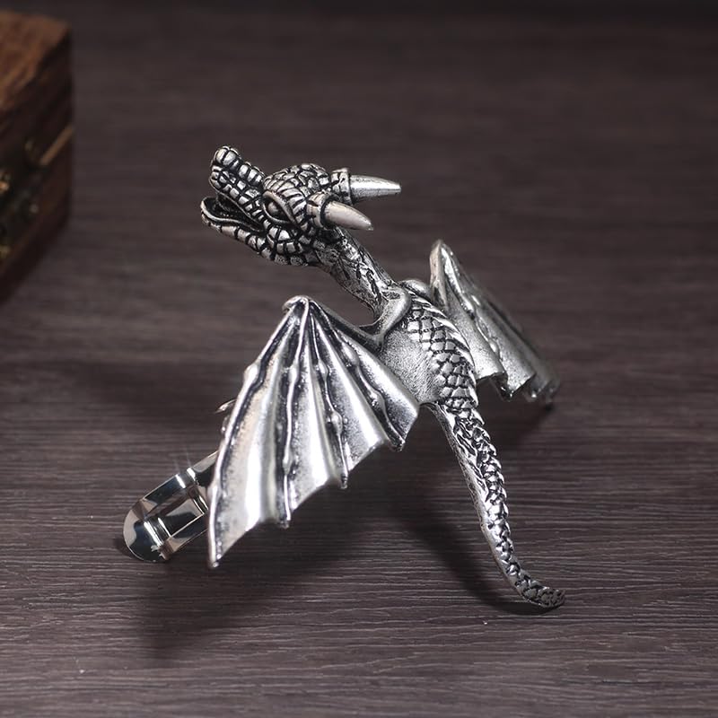 XJYHDY dragon clip held in hand for scale, shows compact size