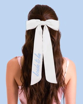 xo, Fetti bow worn in hair lifestyle shot for party-ready look