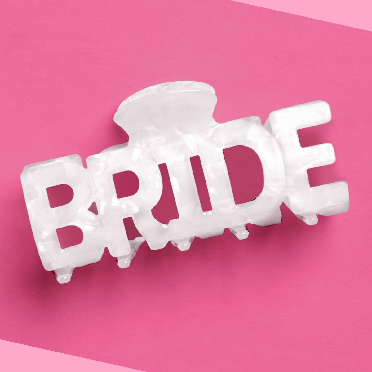 xo, Fetti front view of bride claw clip showing BRIDE letters, stylish bridal detail