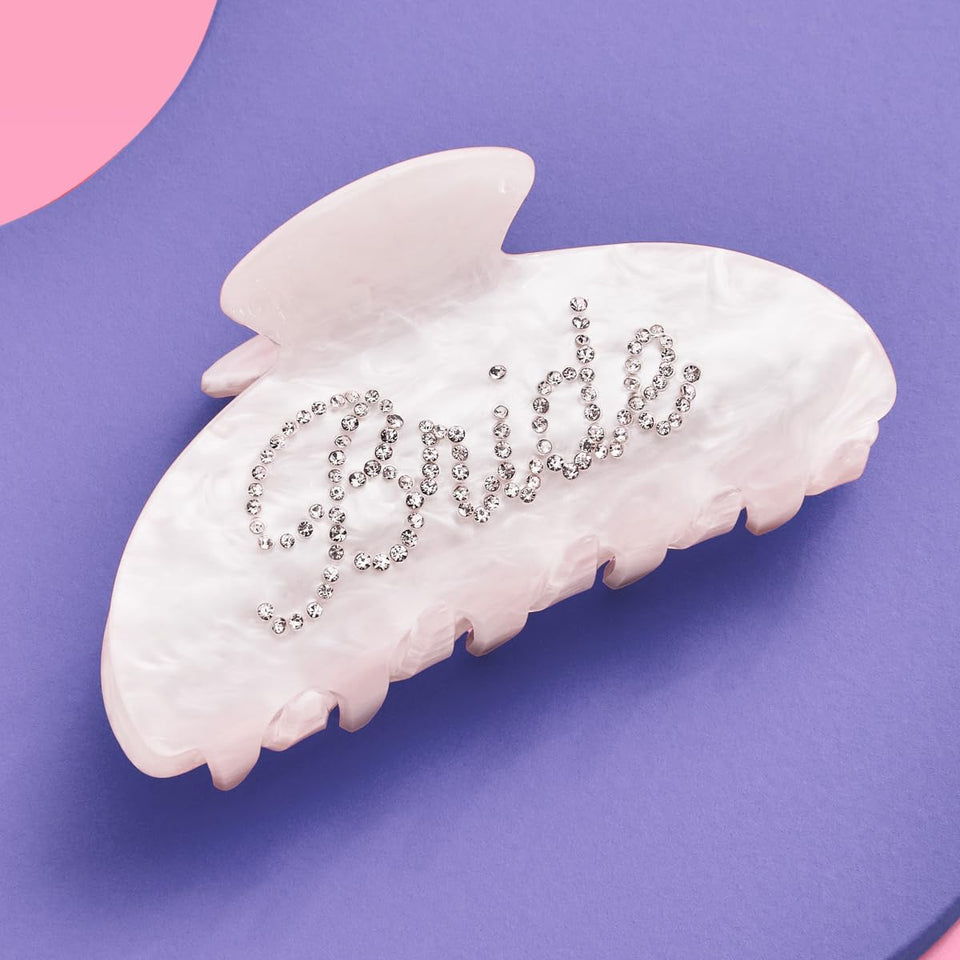 xo, Fetti front view of bride clip showing pearl acrylic and rhinestone logo for stylish look