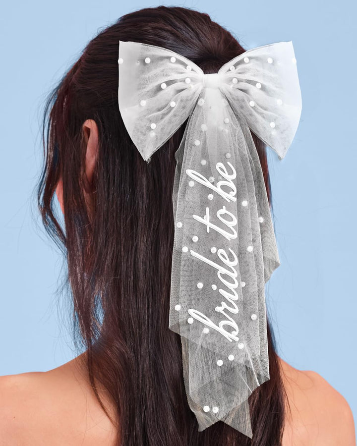 xo, Fetti front view of bow showing tulle tails and bride embroidery for statement photos