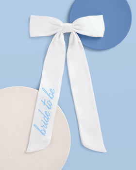 xo, Fetti blue embroidery close-up shows elegant detail