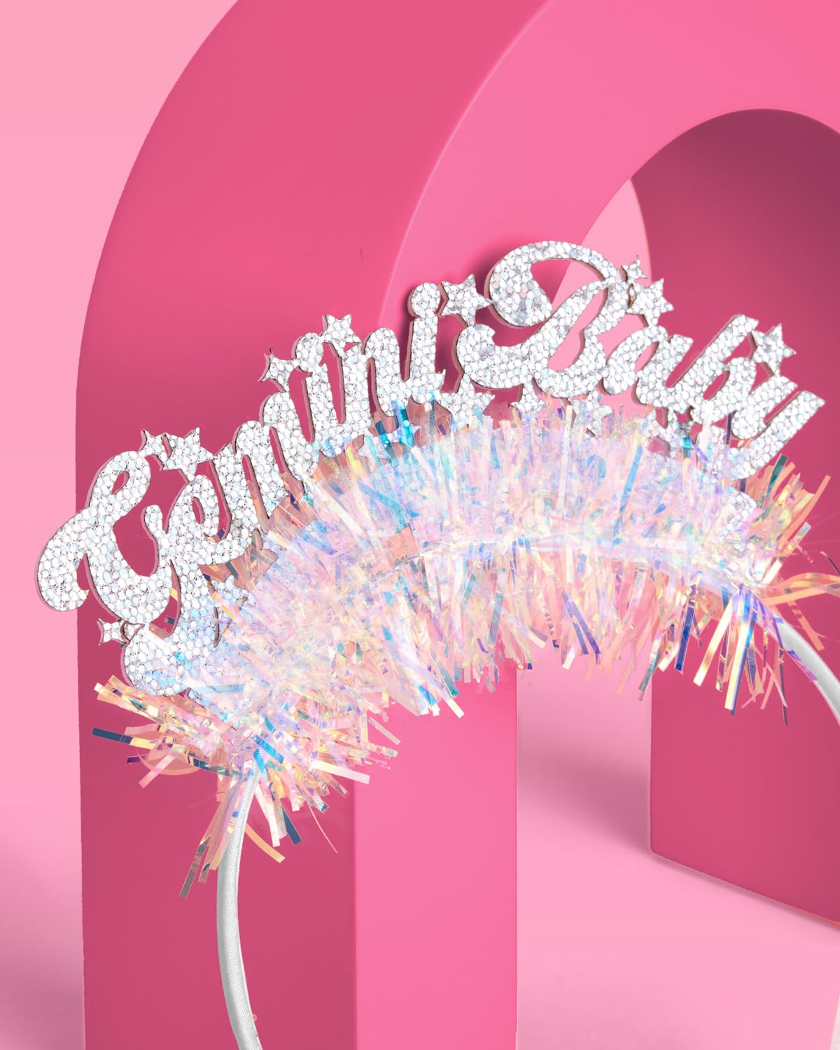 xo, Fetti detail of iridescent fringe adding motion and light reflection