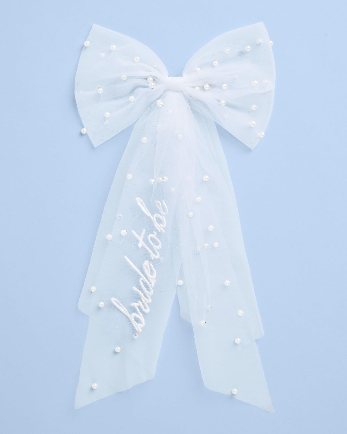 xo, Fetti model wearing bow at bachelorette showing instant celebratory style