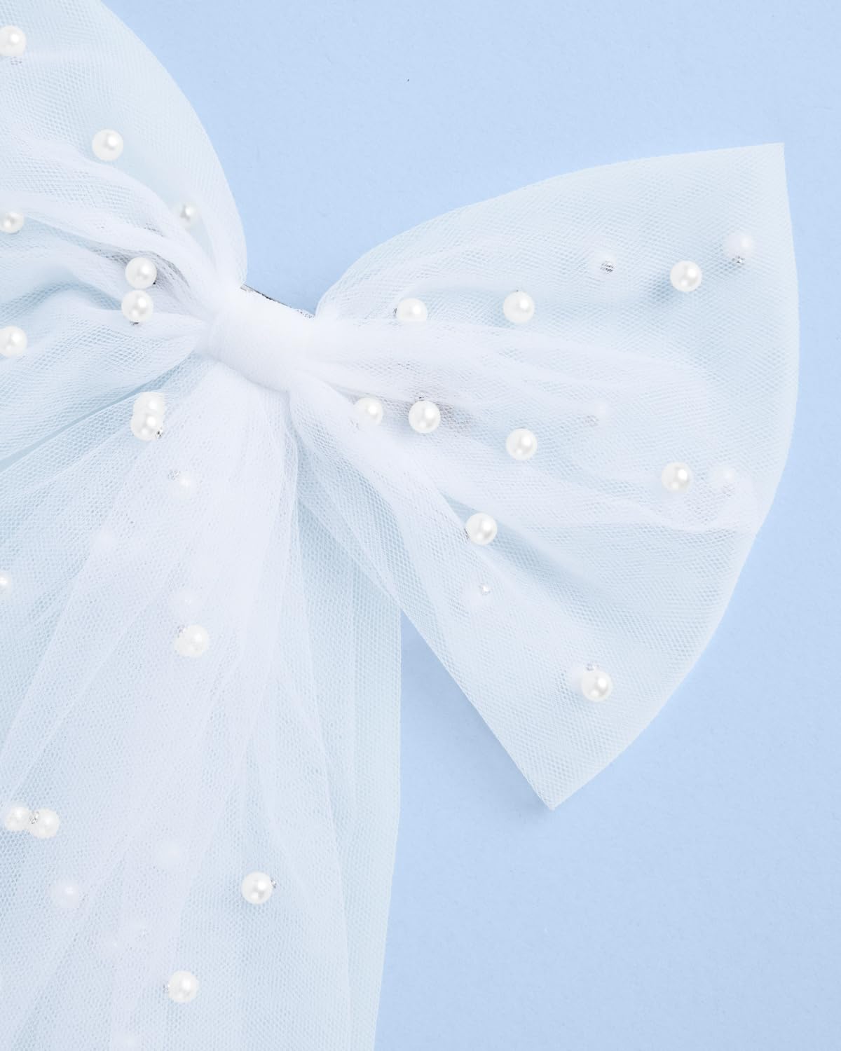 xo, Fetti bow beside ruler showing 17-inch length for size and scale clarity
