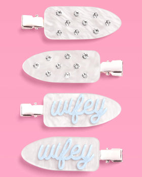 xo, Fetti clips beside ruler showing 2-inch size for comfortable wear