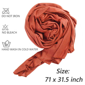 XTREND woman wearing a turban-style wrap showing secure fit and stylish look