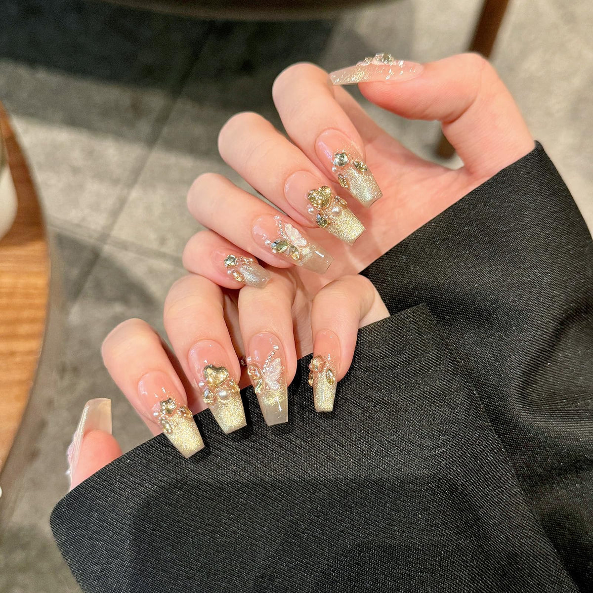 Yacey 3D butterfly detail showcasing handcrafted textured nail art