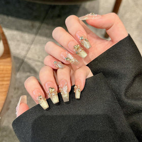 Yacey 3D butterfly detail showcasing handcrafted textured nail art
