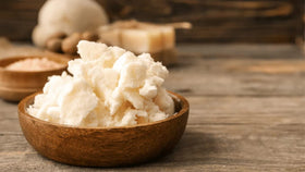 Yajna open jar with spoon revealing unrefined butter and scoopable consistency
