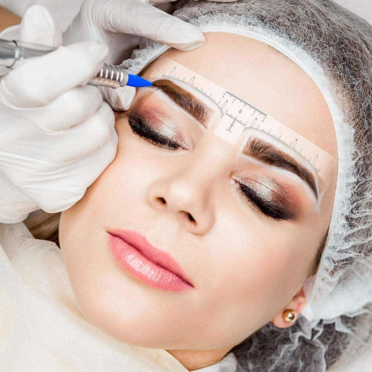 Ybeauty ink ring cup and cling film setup demonstrating hygienic pigment handling