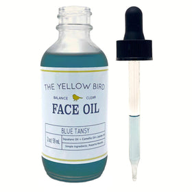 Yellow Bird bottle on bathroom shelf illustrating daily skincare routine