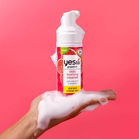 Yes To grapefruit bottle held in hand displaying true size