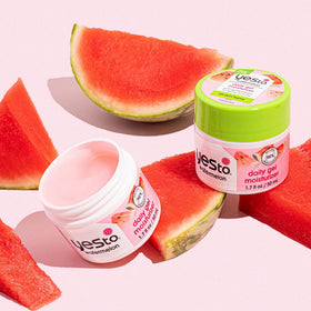 Yes To model applying gel outdoors, conveying refreshed skin and summer-ready glow