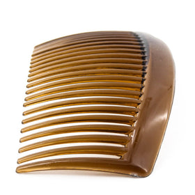 Yeshan comb held in hand showing size and easy portability for on-the-go styling