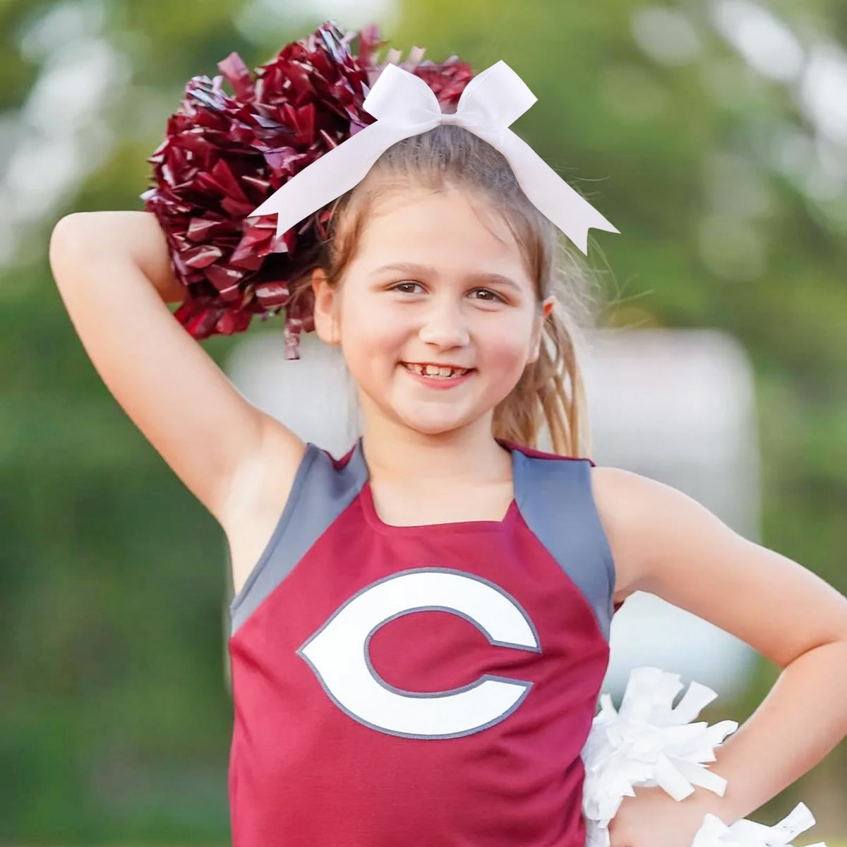 YHXX YLEN cheer team wearing bows in formation showing coordinated look