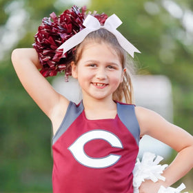 YHXX YLEN cheer team wearing bows in formation showing coordinated look