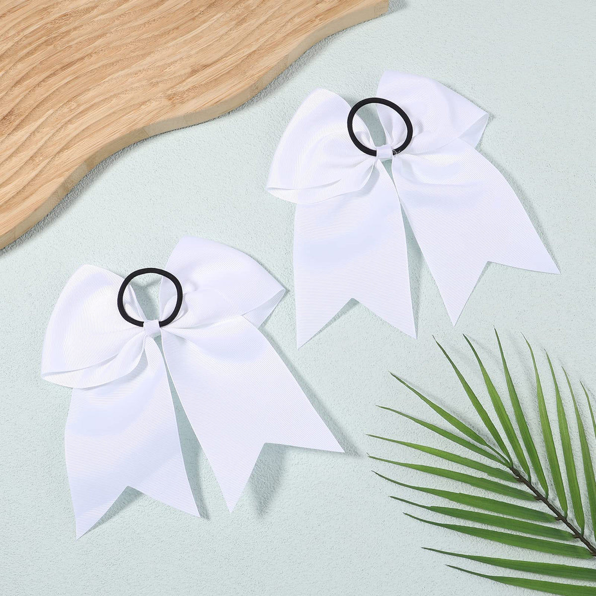 YHXX YLEN team wearing white bows in group photo for uniform look