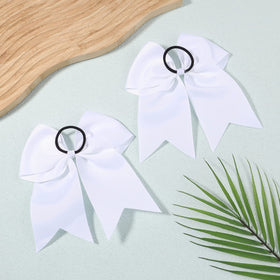 YHXX YLEN team wearing white bows in group photo for uniform look