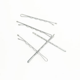 YINGFENG pins on a bathroom counter next to styling tools to illustrate daily use convenience