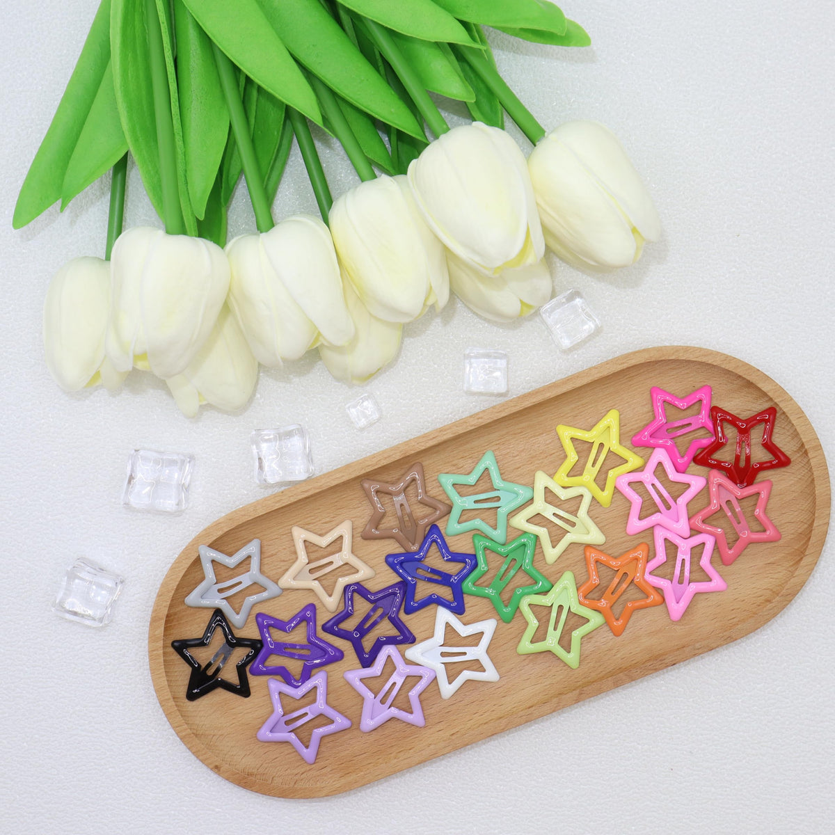 YLMUSU festival hairstyle with multiple star clips adding playful color and eye-catching detail