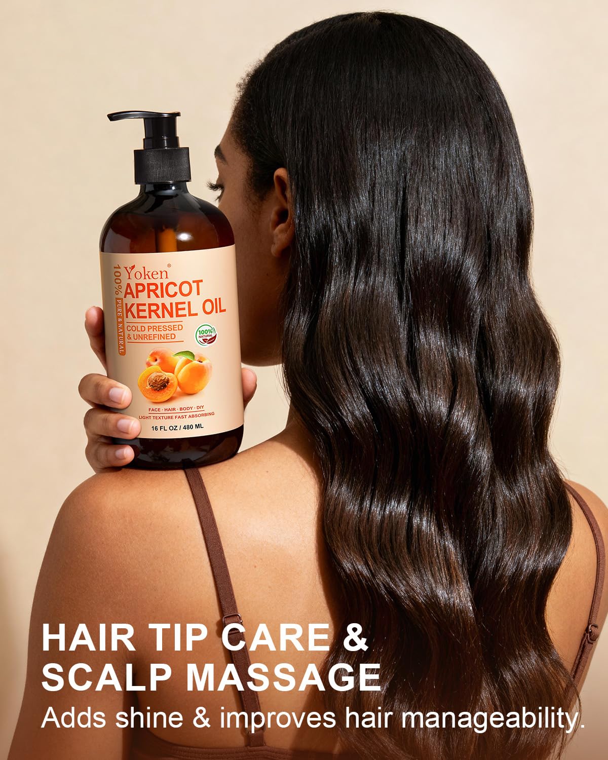Yoken apricot oil 16 oz bottle next to hand showing size and value benefit