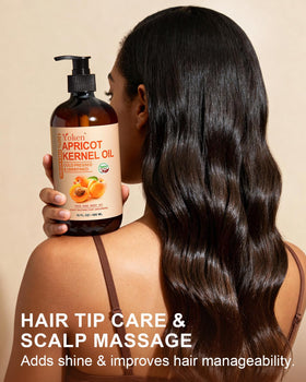 Yoken apricot oil 16 oz bottle next to hand showing size and value benefit