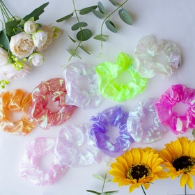 Yomwig scrunchies worn at a carnival-style party demonstrating eye-catching illumination