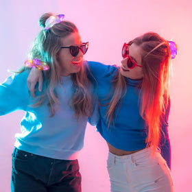 Yomwig scrunchie held in hand to show scale and secure elastic hold for all hair types