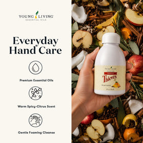 Young Living bottle beside hands to show compact size and convenience