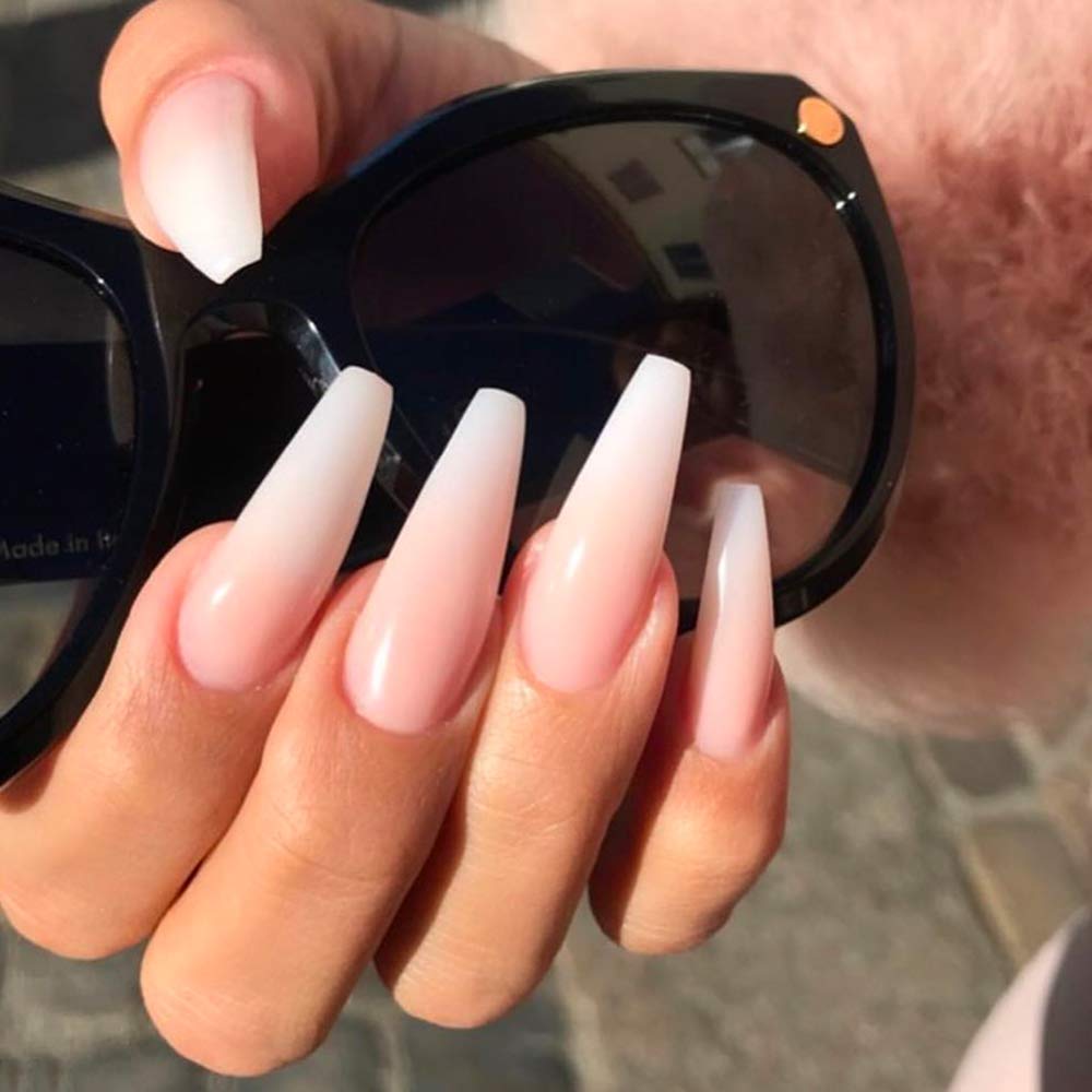 Young Nails top coat in salon setting protecting manicures from dyes