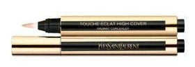 YSL Touch Éclat on vanity in lifestyle setting conveying luxury routine and confidence benefit