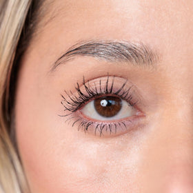 YuYa mascara held in hand for size comparison and portability benefit