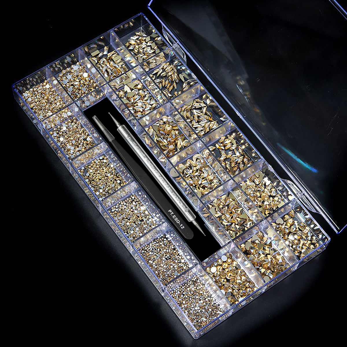 Yzzseven crystals used in a craft workspace showing phone case and accessory decoration possibilities