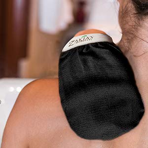 Zakia's Morocco wet mitt shown shrunk and fitting snug on hand for precise exfoliation