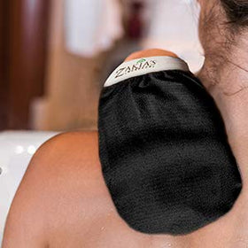 Zakia's Morocco wet mitt shown shrunk and fitting snug on hand for precise exfoliation