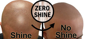 Person checking scalp in mirror after applying Zero Shine for natural appearance