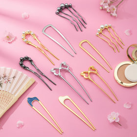Zesucal pins next to ruler showing scale and ideal size for updos